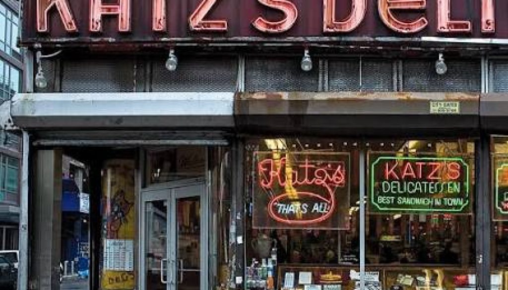 Katz’s Delicatessen is famous for its massive, hand-carved pastrami sandwiches, its enduring legacy as New York's oldest operating deli (established 1888), and its iconic feature in the 1989 film When Harry Met Sally.