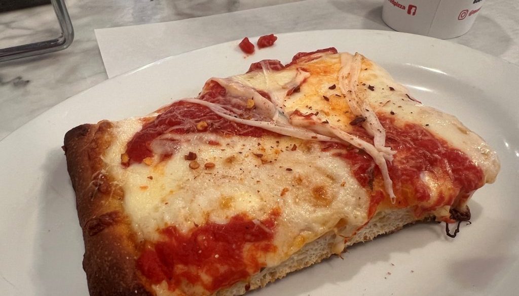 No visit to a pizza shop is complete without trying their Sicilian slice