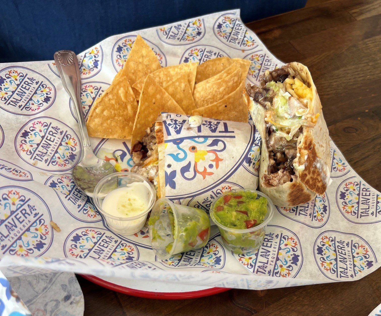 The $14 chicken burrito platter, served with guac and sour cream