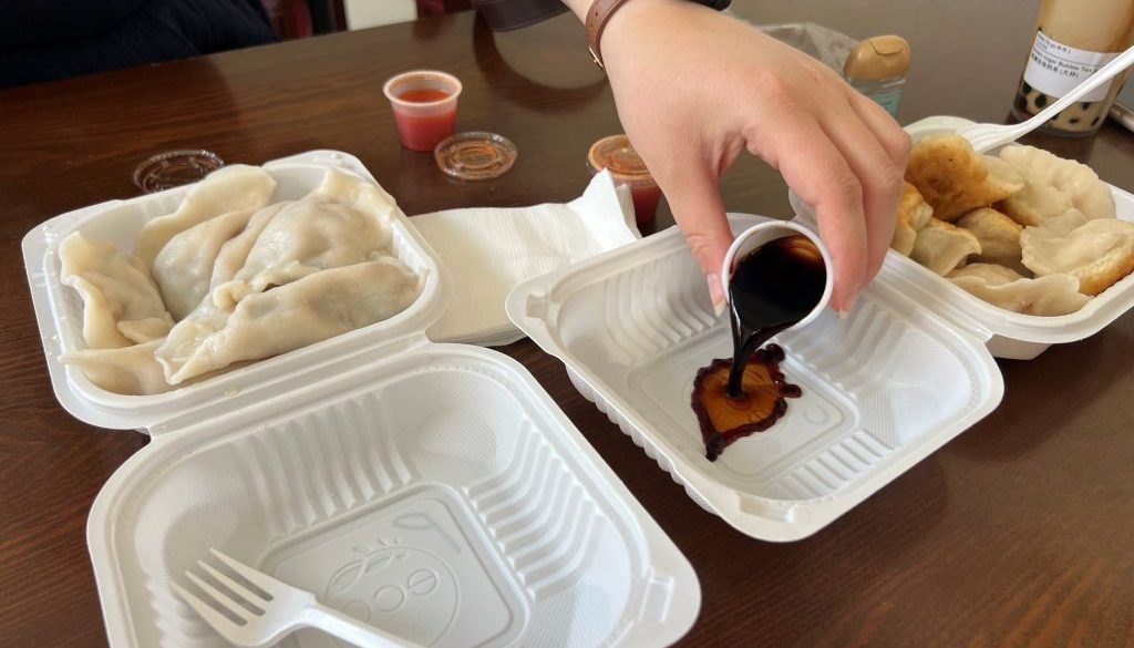 At our 2nd stop, Kai Feng Fu Dumpling House. Pouring some dipping sauce for our dumpling order.