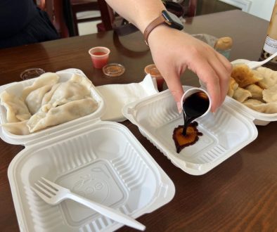 At our 2nd stop, Kai Feng Fu Dumpling House. Pouring some dipping sauce for our dumpling order.