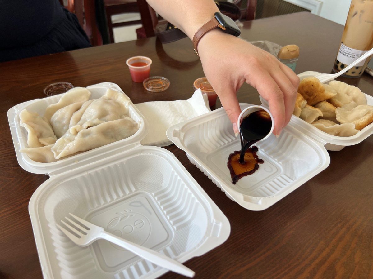 sunset-park-dumpling-crawl-kai-feng-fu-dumpling-house-pouring-dipping-soy-sauce At our 2nd stop, Kai Feng Fu Dumpling House. Pouring some dipping sauce for our dumpling order.