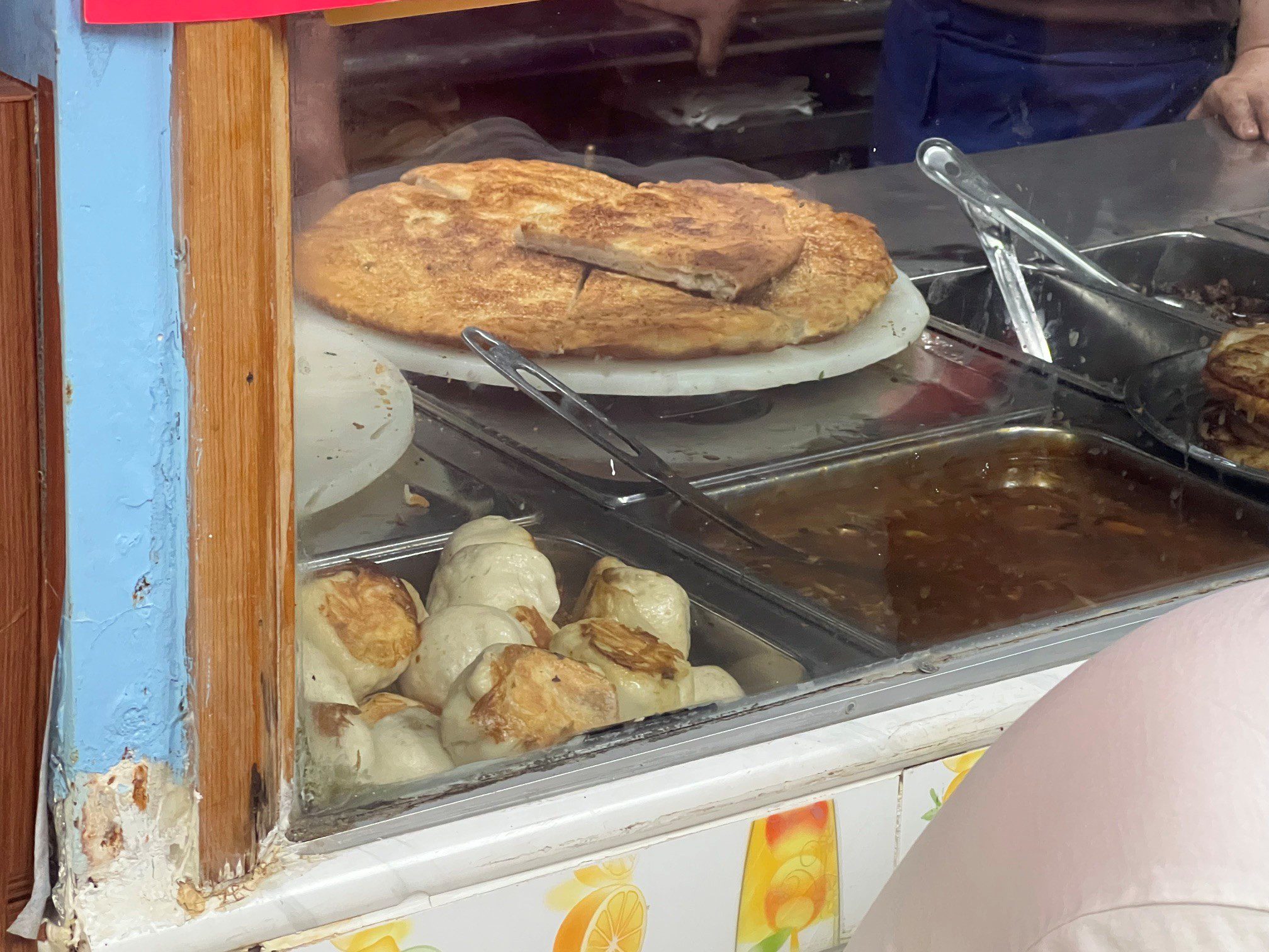 sunset-park-dumpling-crawl-kai-feng-fu-dumpling-house-scallion-pancake Scallion pancake at Kai Feng Fu Dumpling House, waiting to be sliced